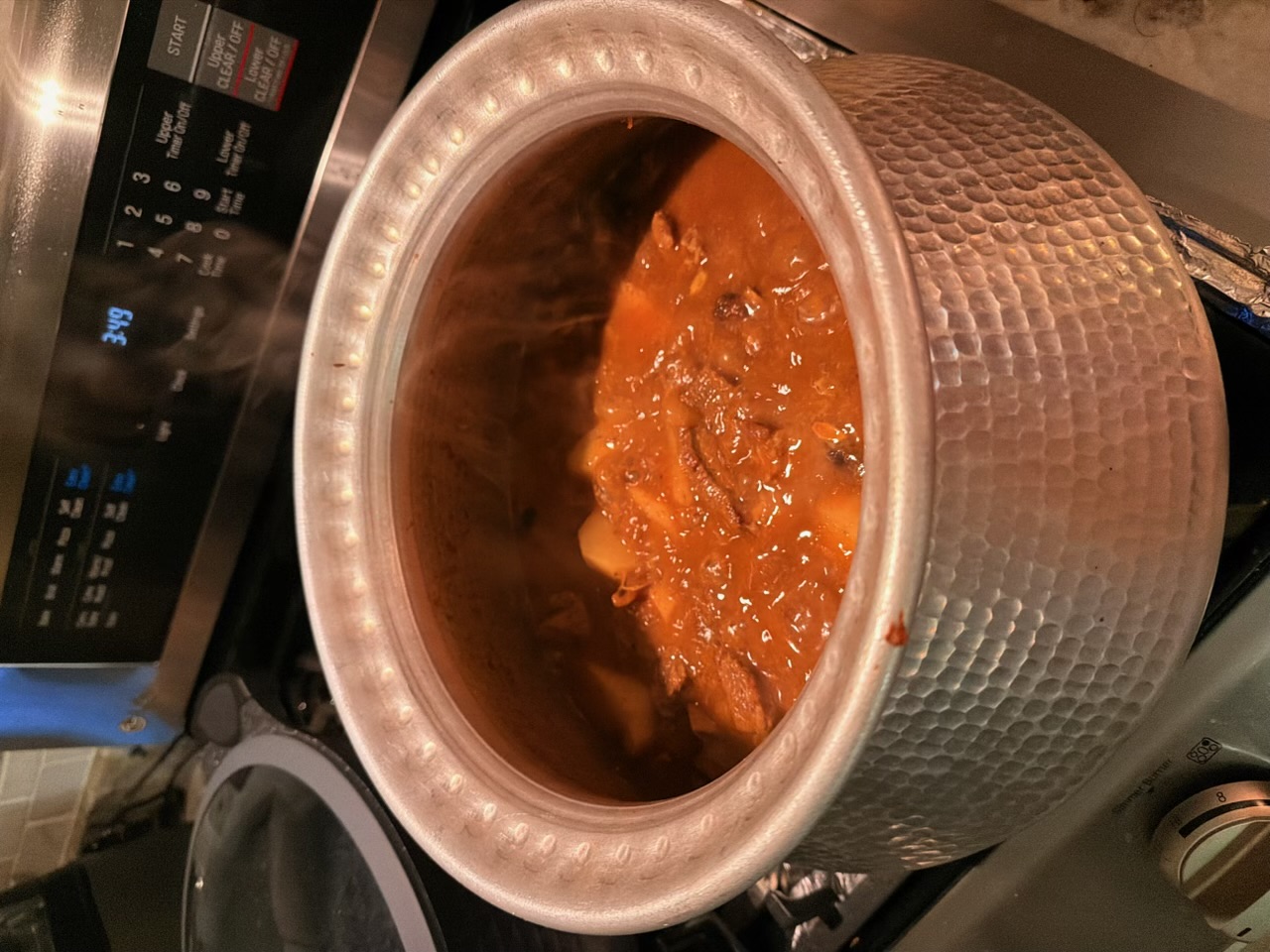 The masala base, simmering
